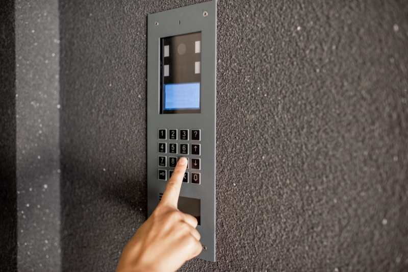 Intercom system on the side of a brick all for apartment entry