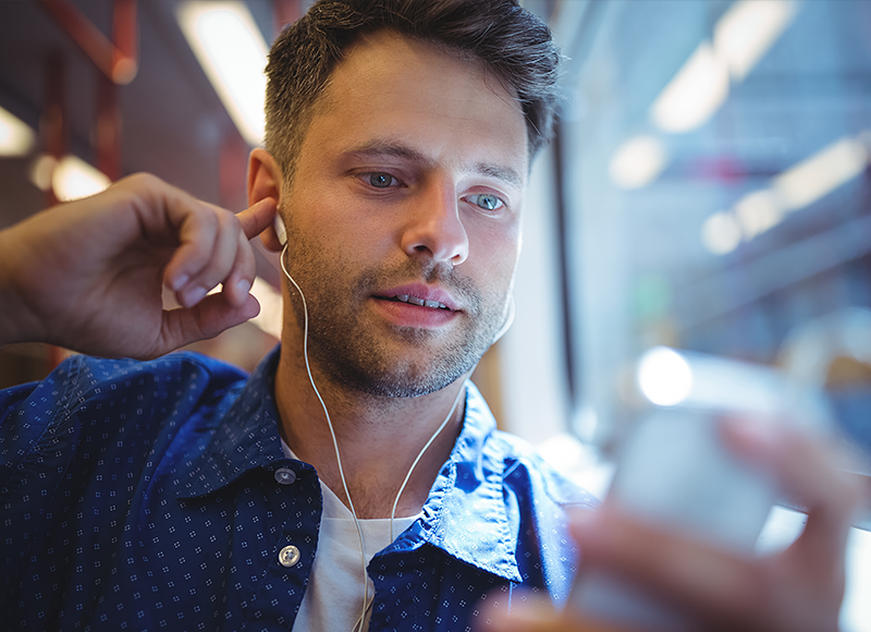 Man using his phone and looking at an app